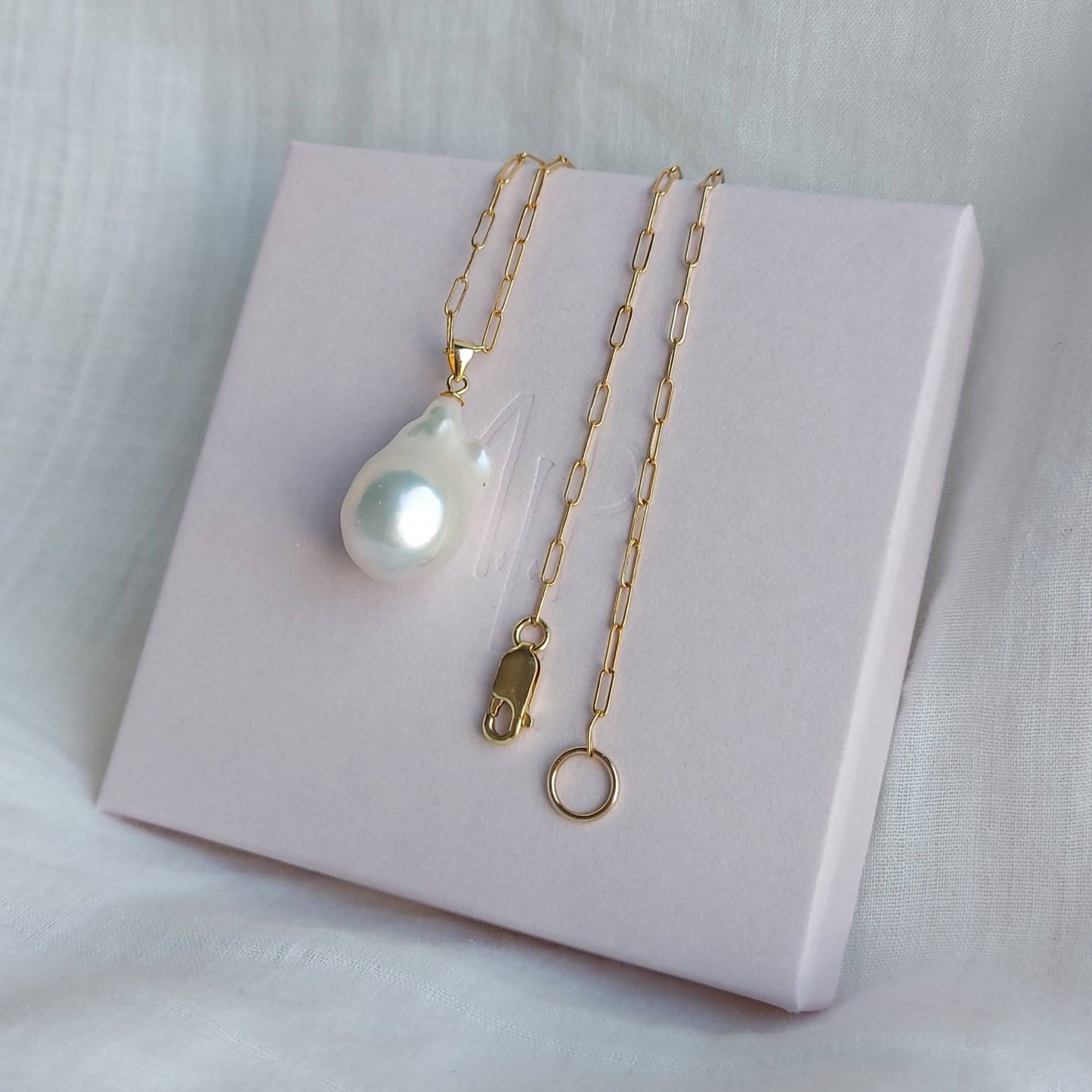 Chloe flameball pearl on a fine gilded paperclip chain