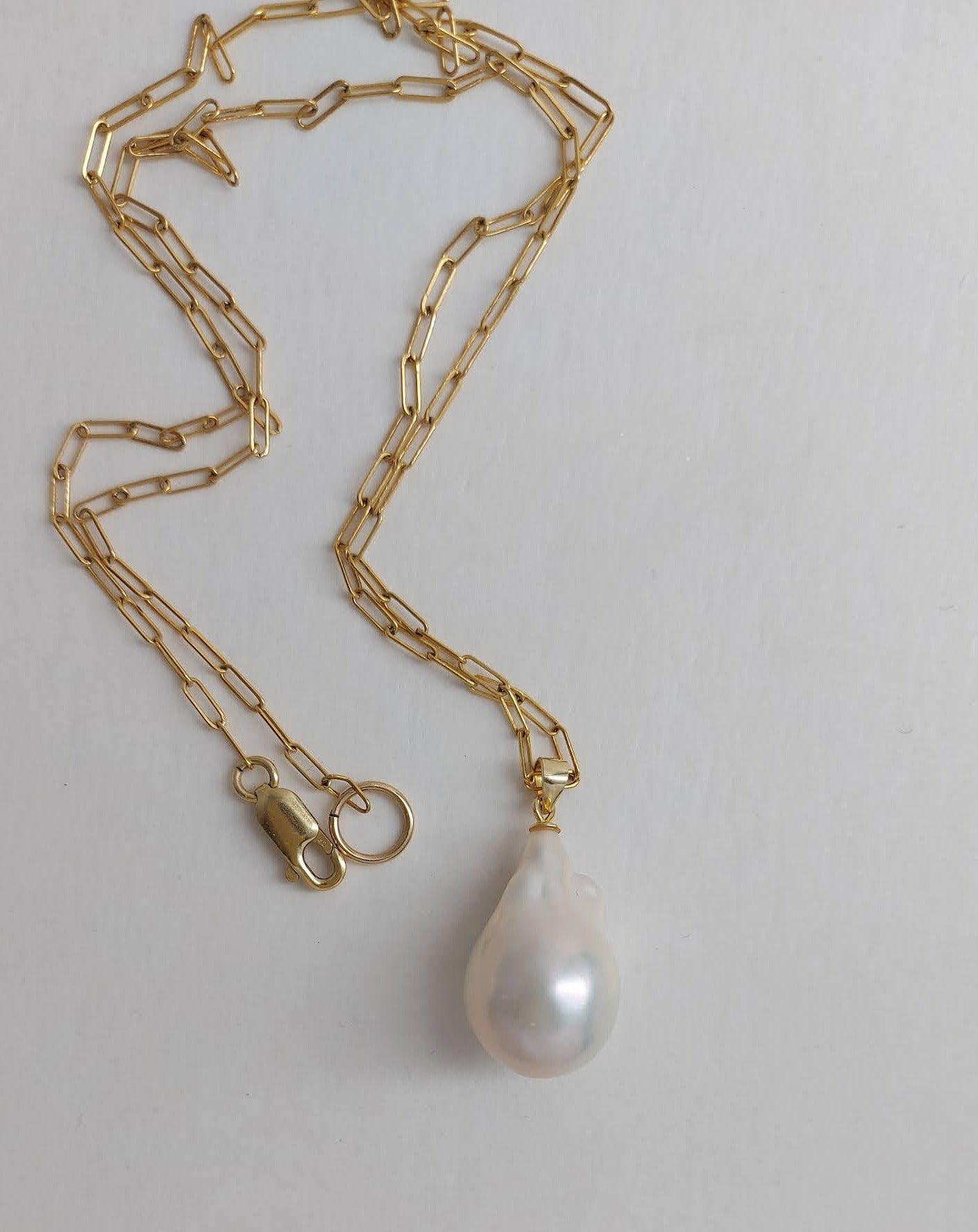 Chloe flameball pearl on a fine gilded paperclip chain