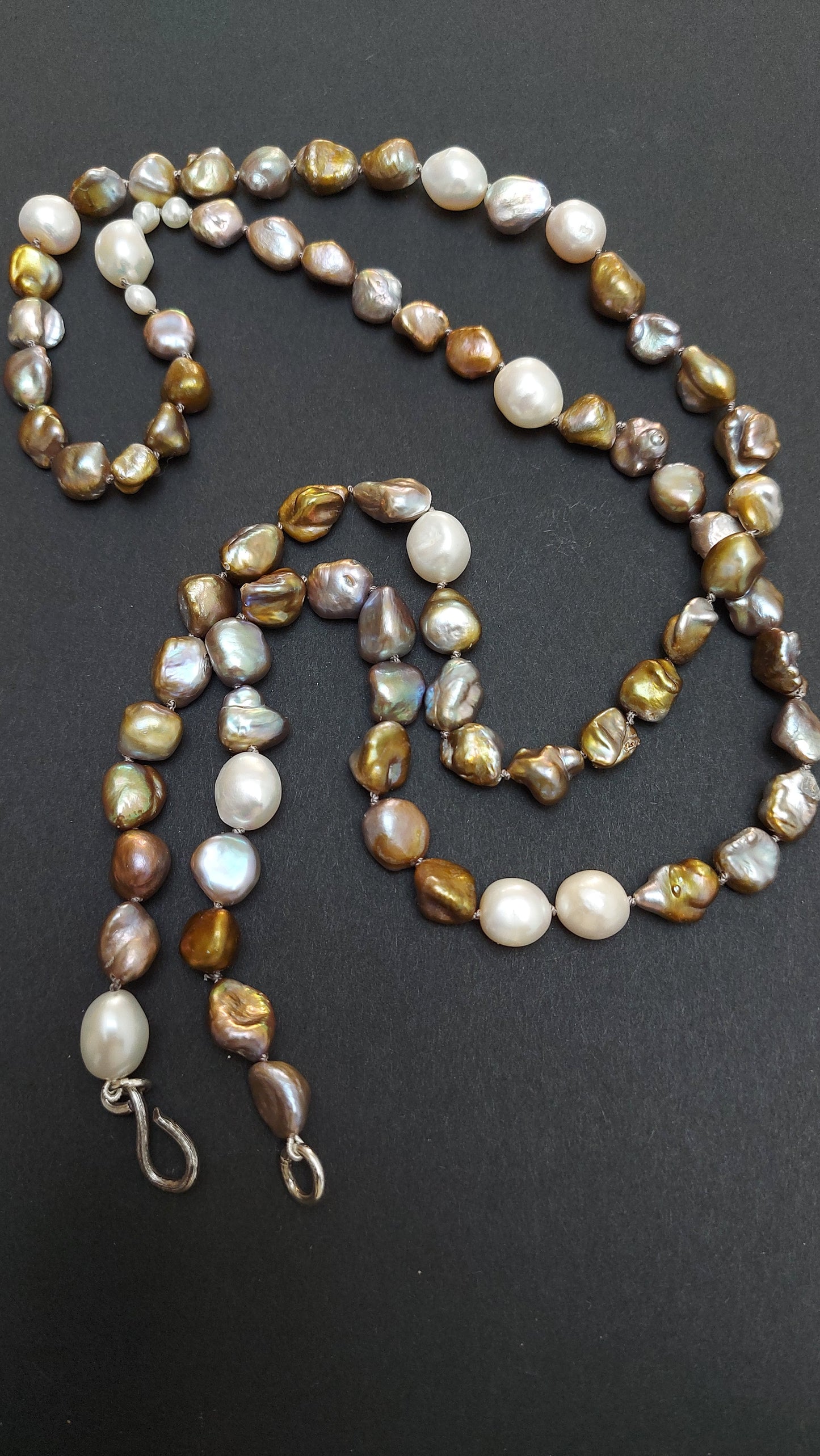 Long hand-knotted bronze baroque pearl necklace studded with white pearls silver hook clasp