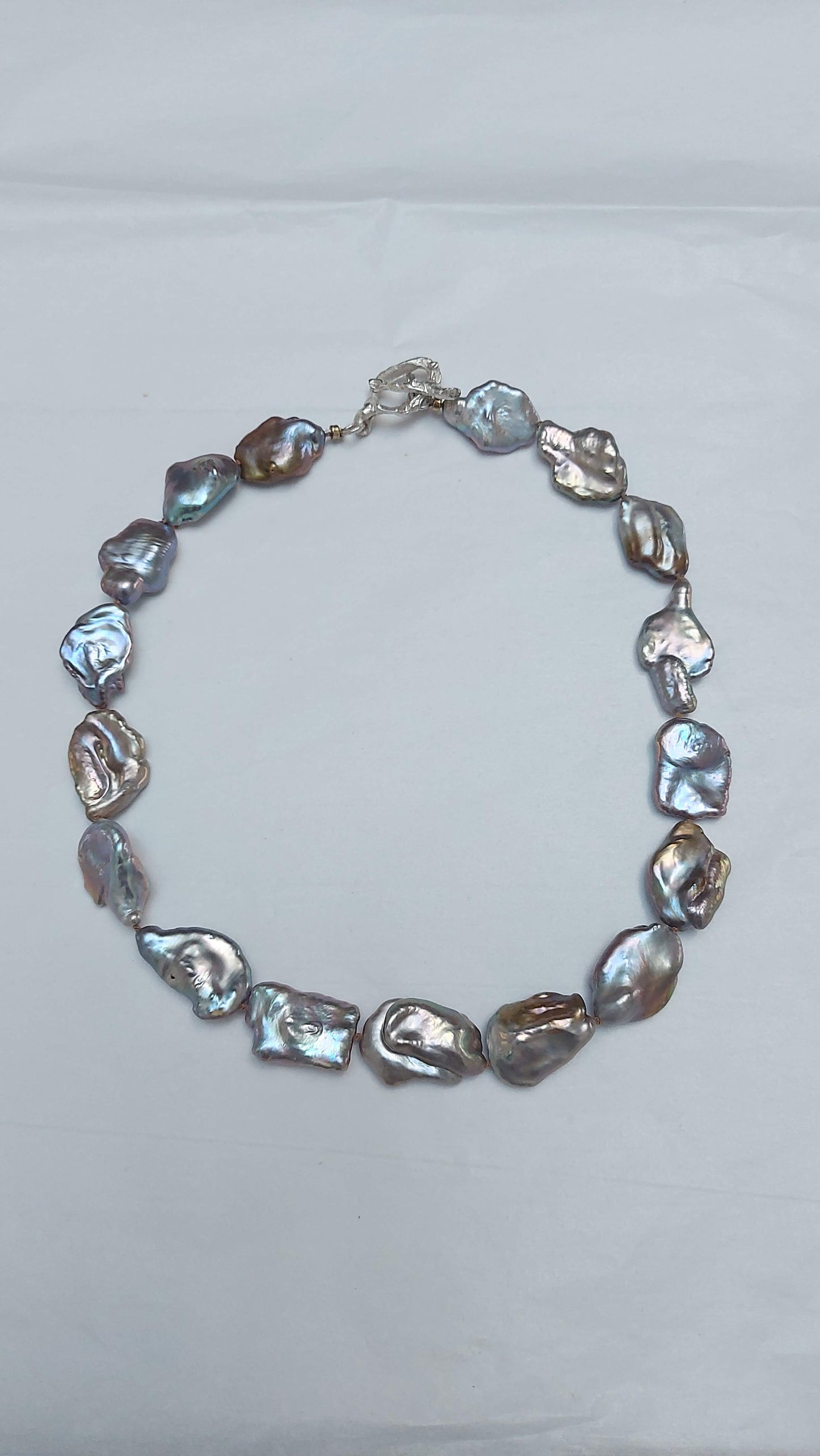 Blue bronze baroque pearl knotted necklace with silver oyster world toggle clasp