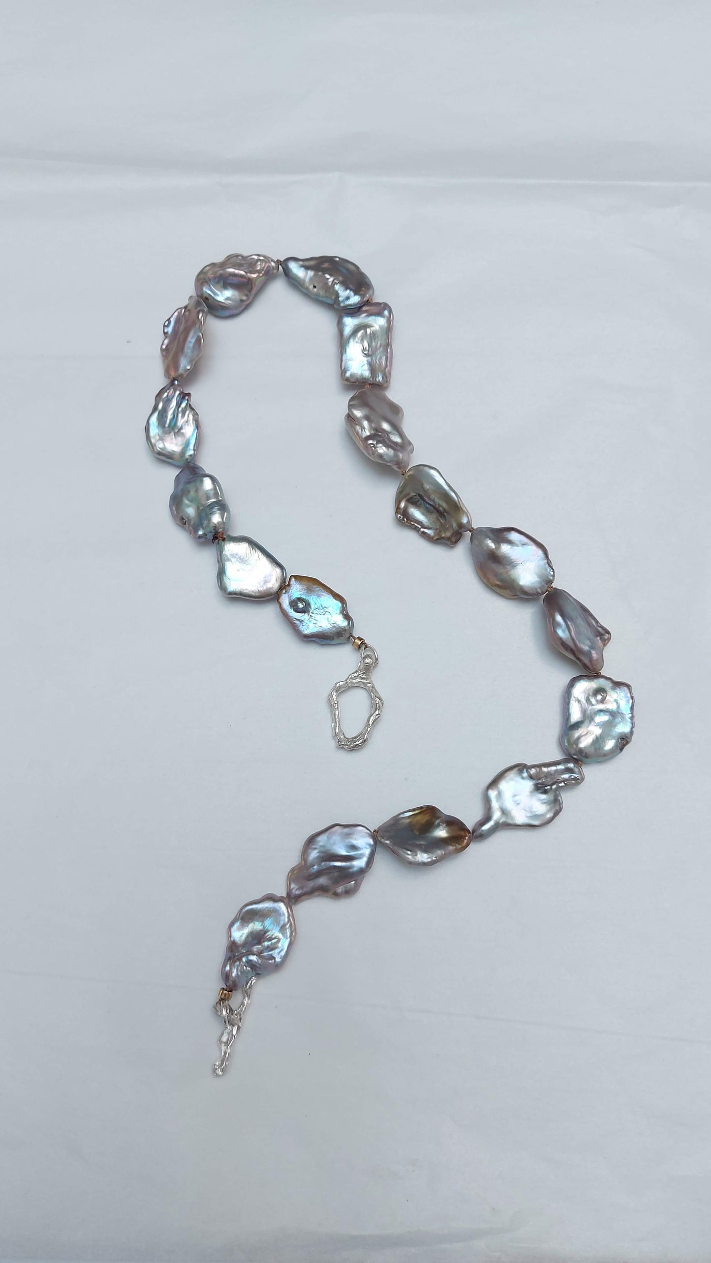 Blue bronze baroque pearl knotted necklace with silver oyster world toggle clasp